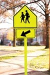 W16 7a school crossing left arrow sign